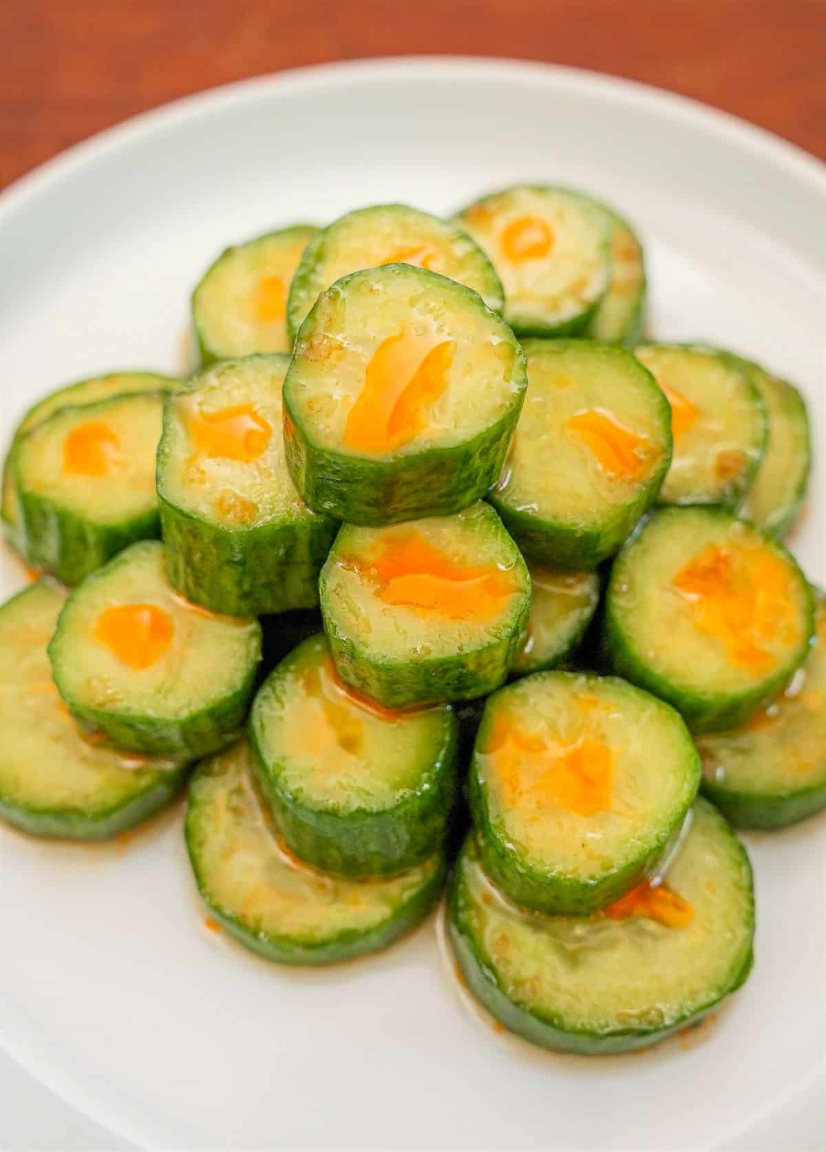 Copycat Din Tai Fung Cucumber Salad stacked on a white plate.