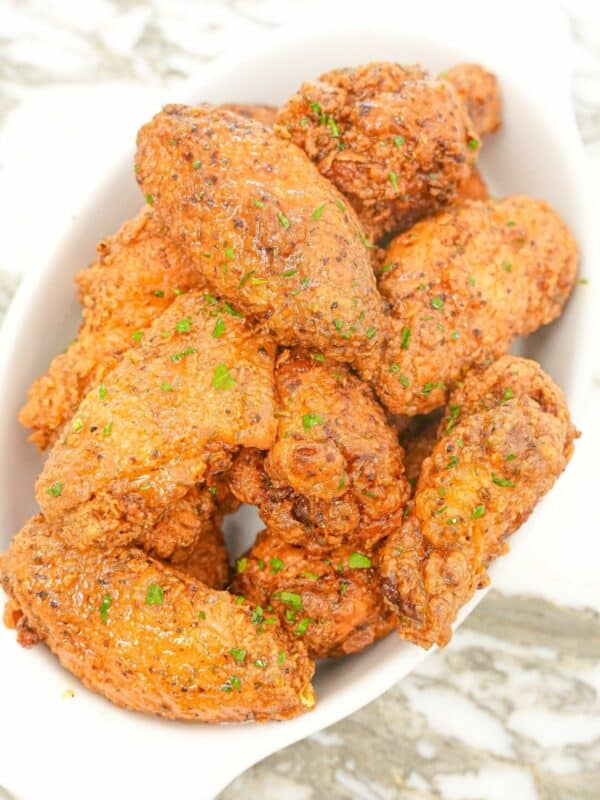 Lemon Pepper Wings on a white tray.