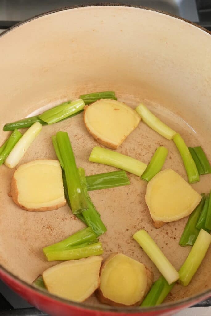 Sauteing ginger and scallions in oil in a dutch oven