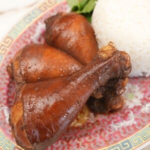 Soy sauce chicken on a plate with rice