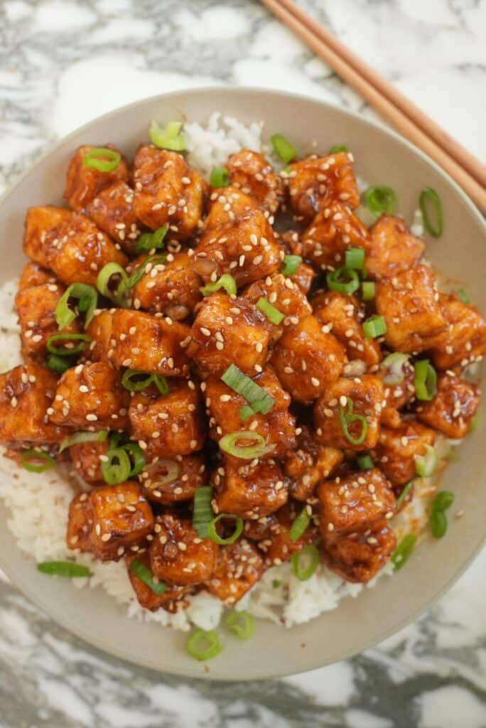 Spicy Honey Garlic Tofu in a bowl over rice