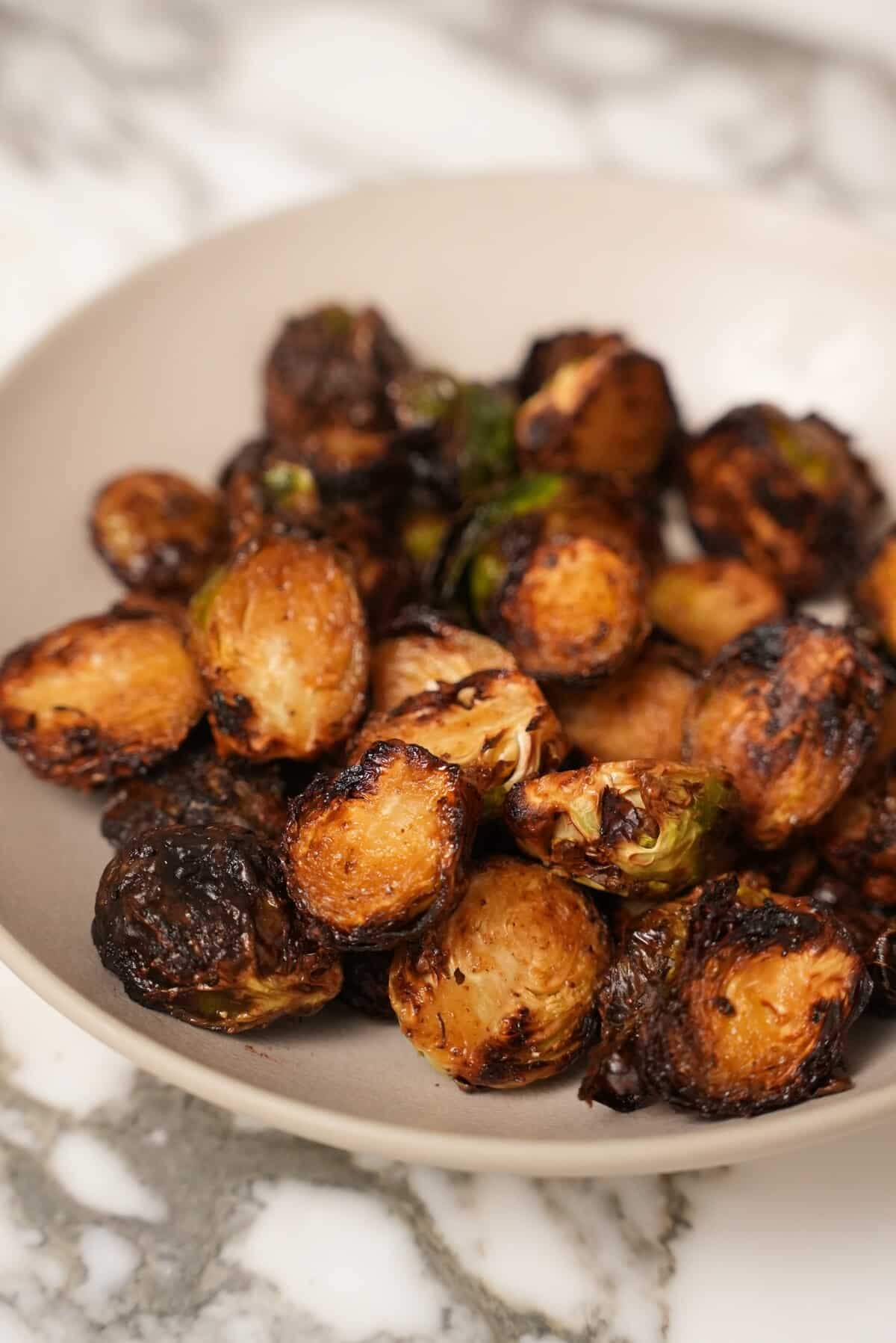 https://cjeatsrecipes.com/wp-content/uploads/2023/11/Air-Fryer-Brussels-Sprouts-Close-Up-rotated.jpg