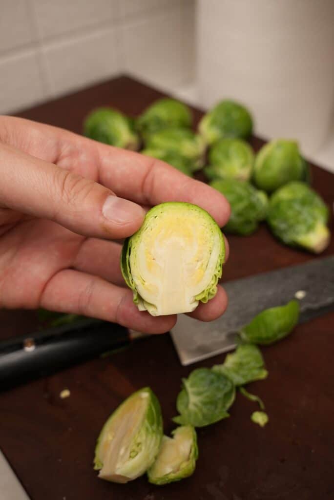 Clean raw brussels sprout cut in half