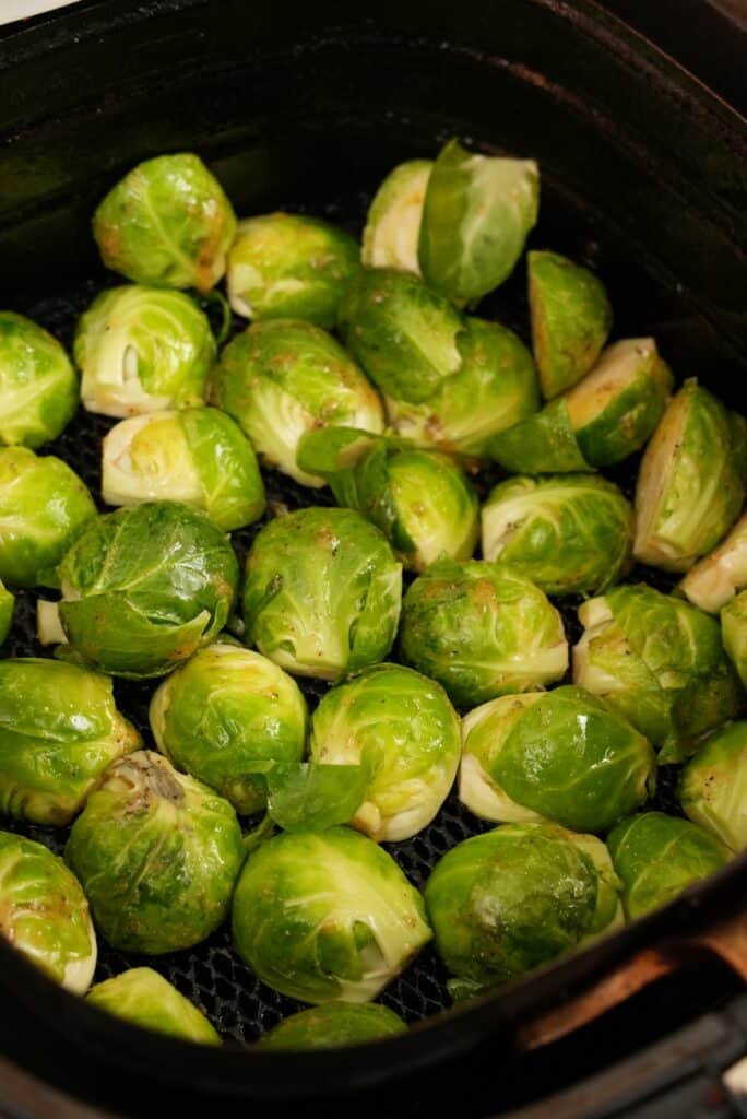 Brussels sprouts in air fryer basket 