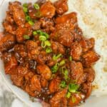 Chinese bourbon chicken on a plate with rice.