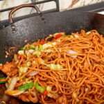 Authentic, restaurant quality Chicken Lo Mein cooked in a wok.