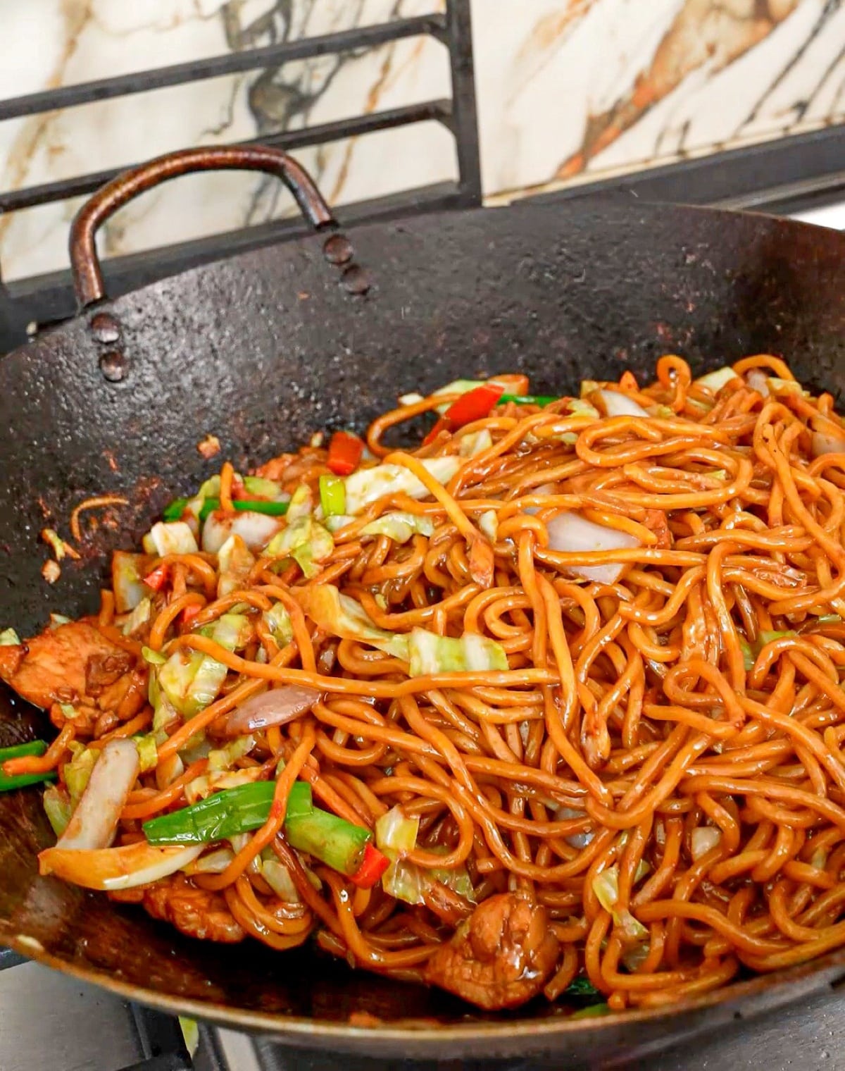 Authentic, restaurant quality Chicken Lo Mein cooked in a wok.