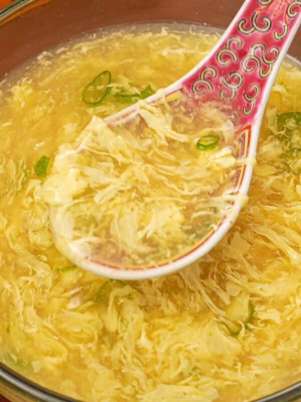 Egg Drop soup in a bowl with a spoon.