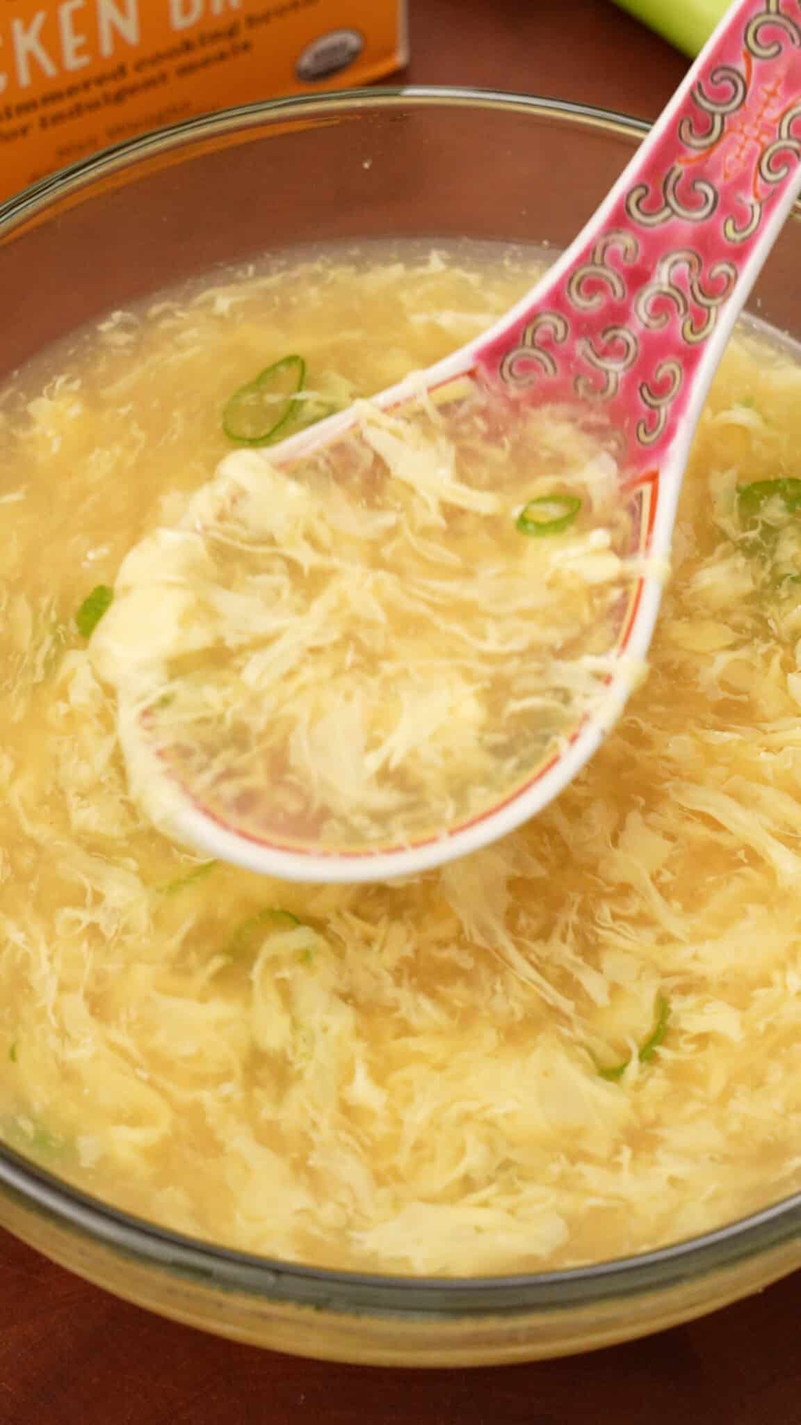 https://cjeatsrecipes.com/wp-content/uploads/2023/12/Egg-Drop-Soup-in-a-spoon-over-bowl-scaled.jpg