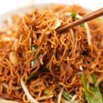 Soy Sauce Pan Fried Noodle Chow Mein in a bowl with chopsticks.