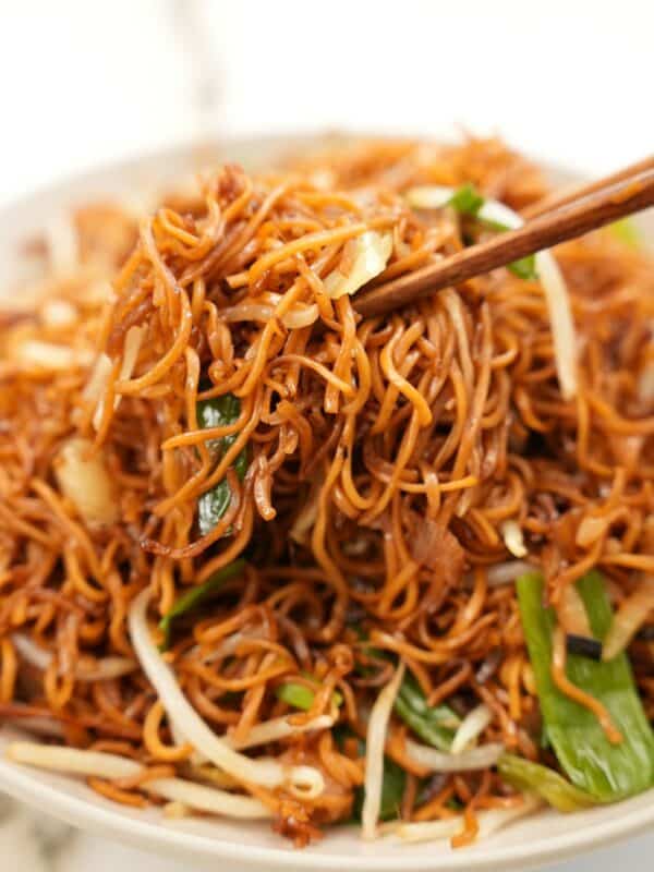 Soy Sauce Pan Fried Noodle Chow Mein in a bowl with chopsticks.