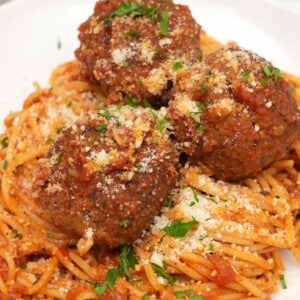 Spaghetti and Meatballs on a white plate.
