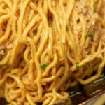 Garlic Noodles with crab cooked in a wok.