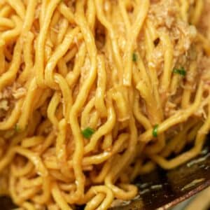 Garlic Noodles with crab cooked in a wok.