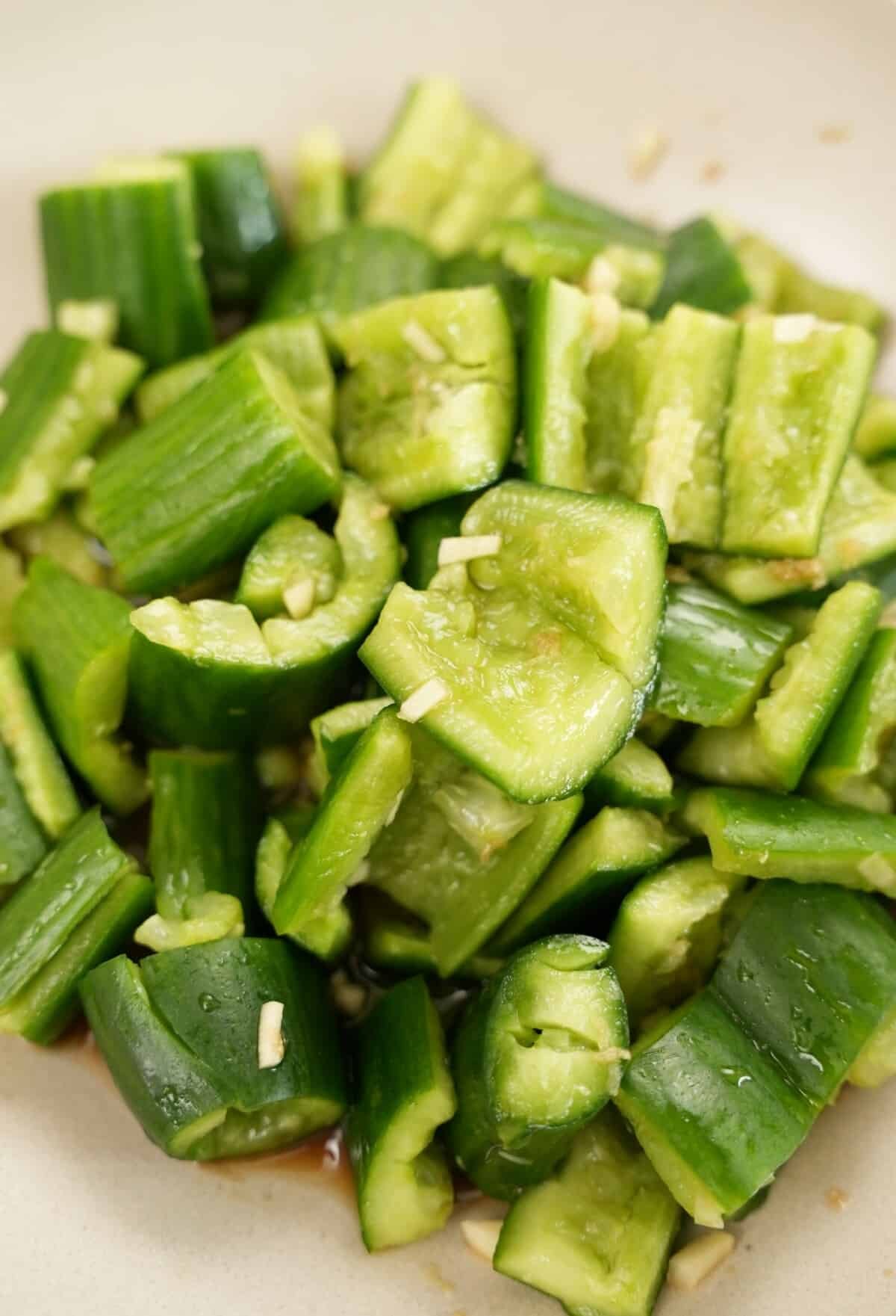 Chinese smashed cucumber salad in a round bowl.