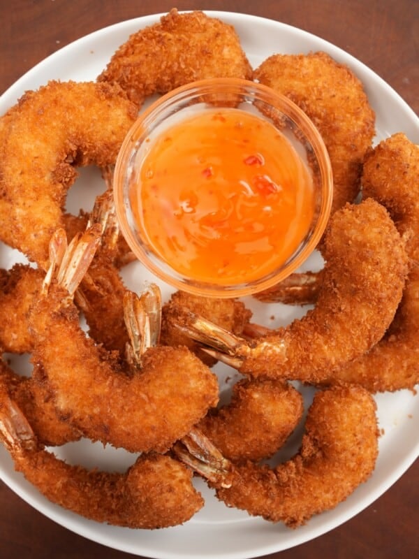 Coconut Shrimp on a plate with sweet chili sauce.