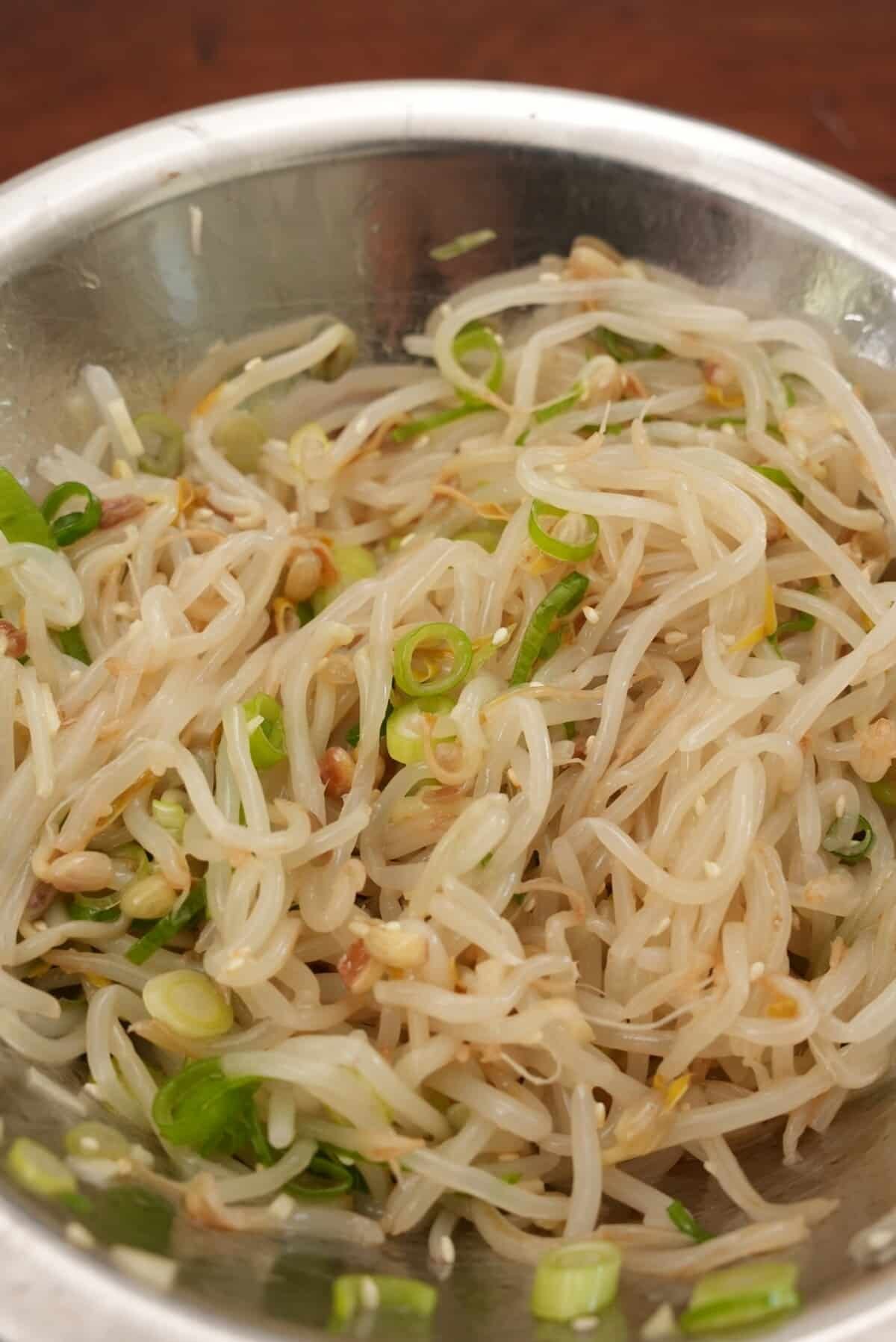 Marinated Korean Bean Sprouts in a metal bowl.