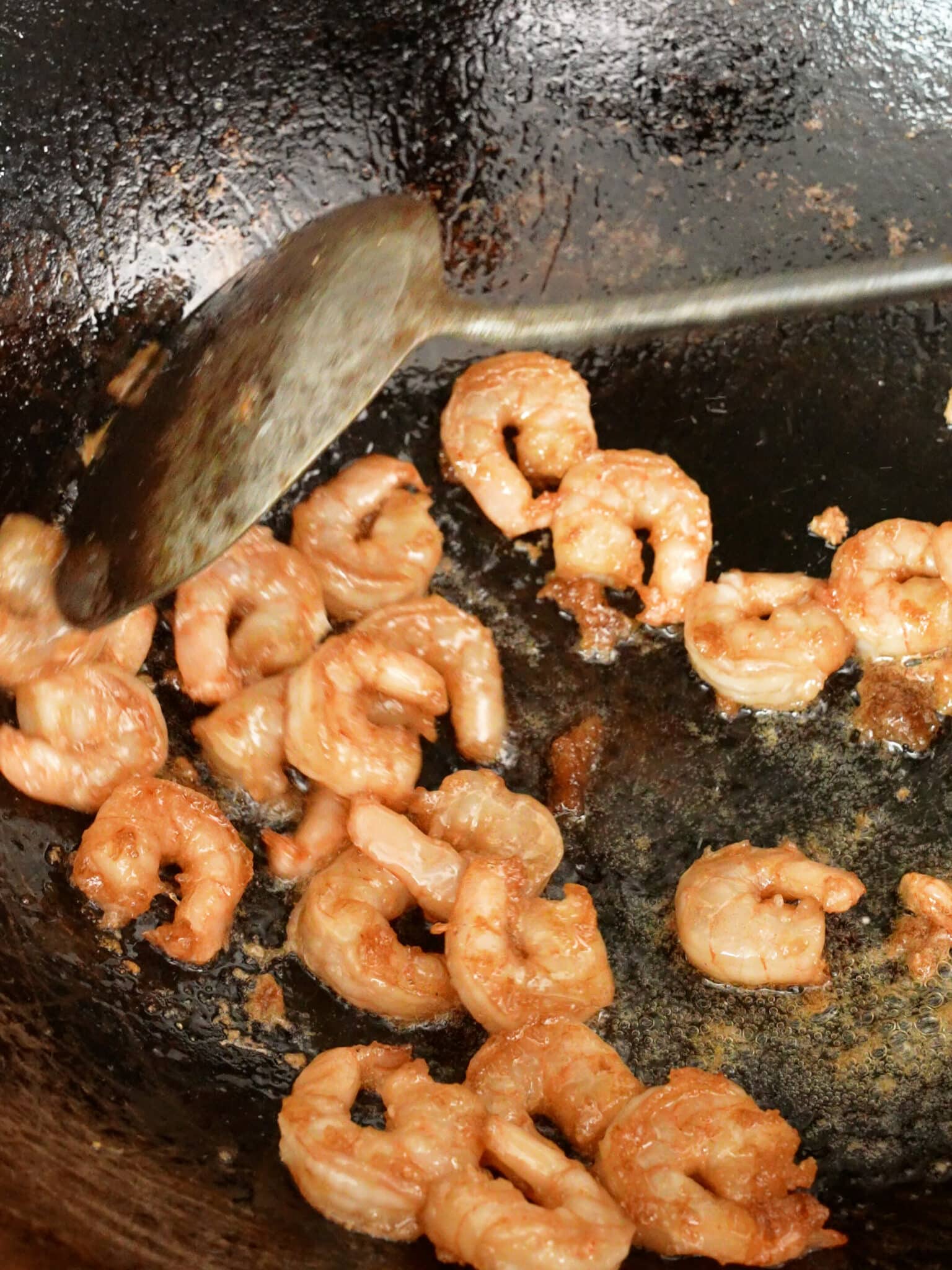 Shrimp cooking in a wok.
