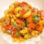 Cashew Chicken on a plate with white rice.
