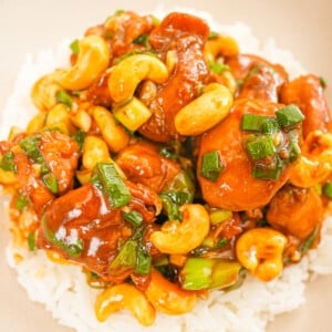 Cashew Chicken on a plate with white rice.