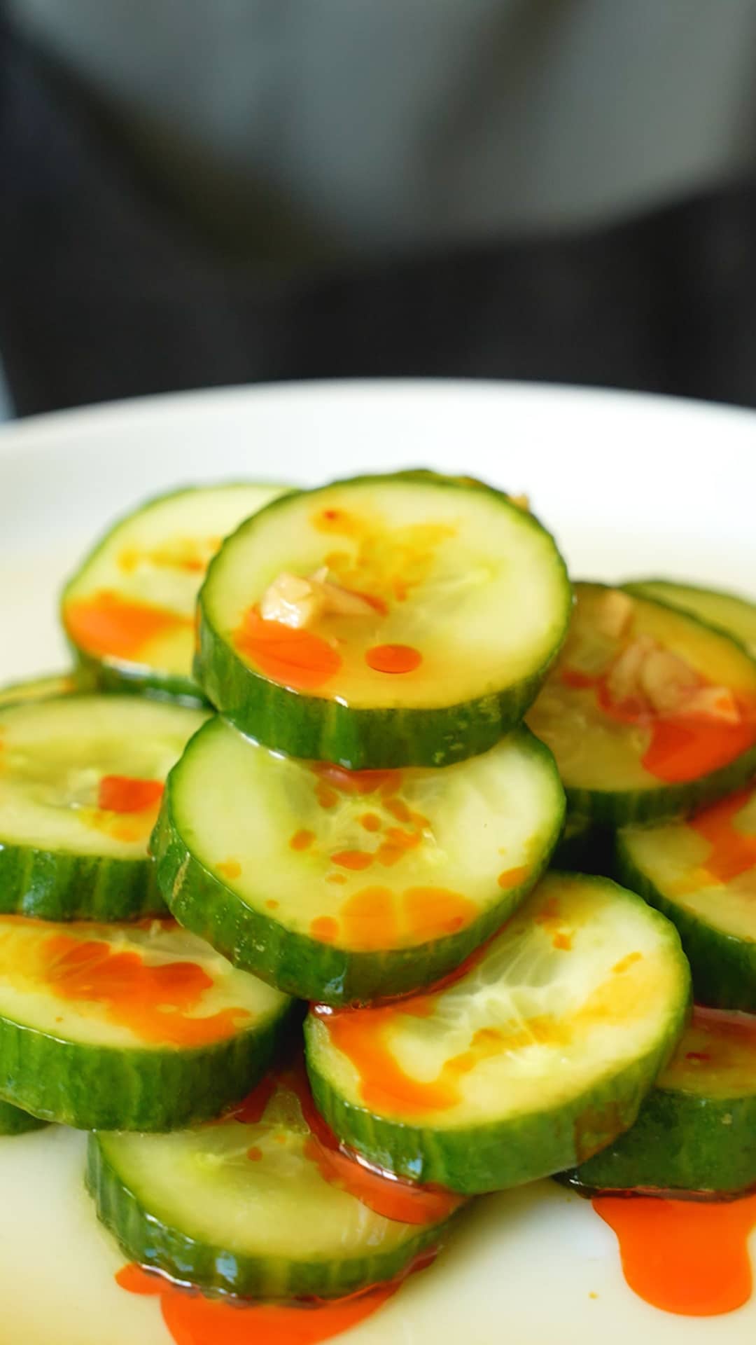 Chinese cucumber salad stacked on a white plate.