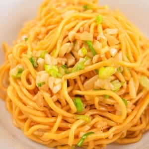 Garlic Noodles in a white bowl.