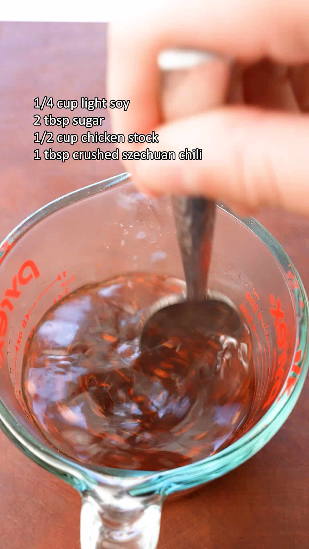 Mixing General Tso's sauce in a glass measuring cup.