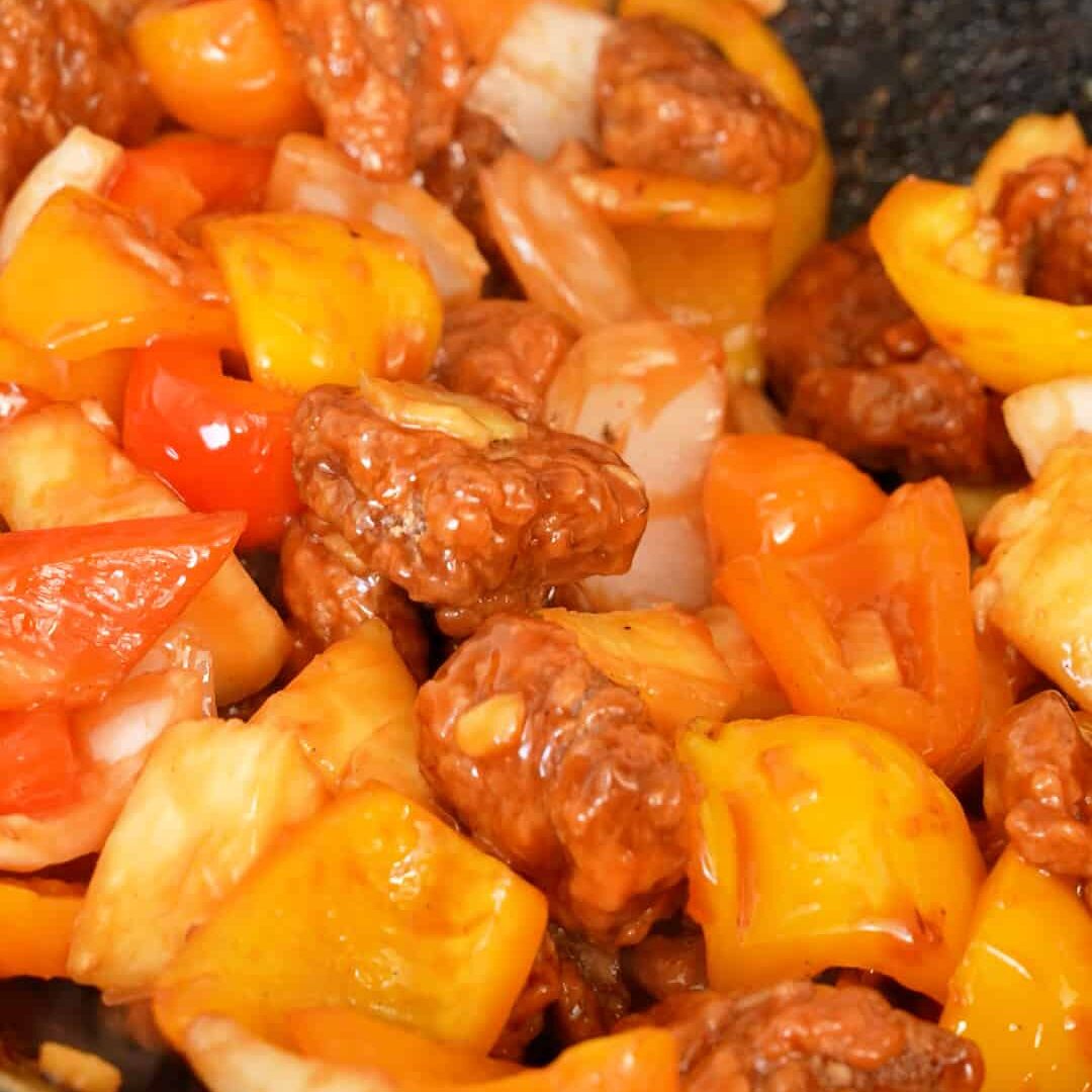 Sweet and Sour pork cooked in a wok.