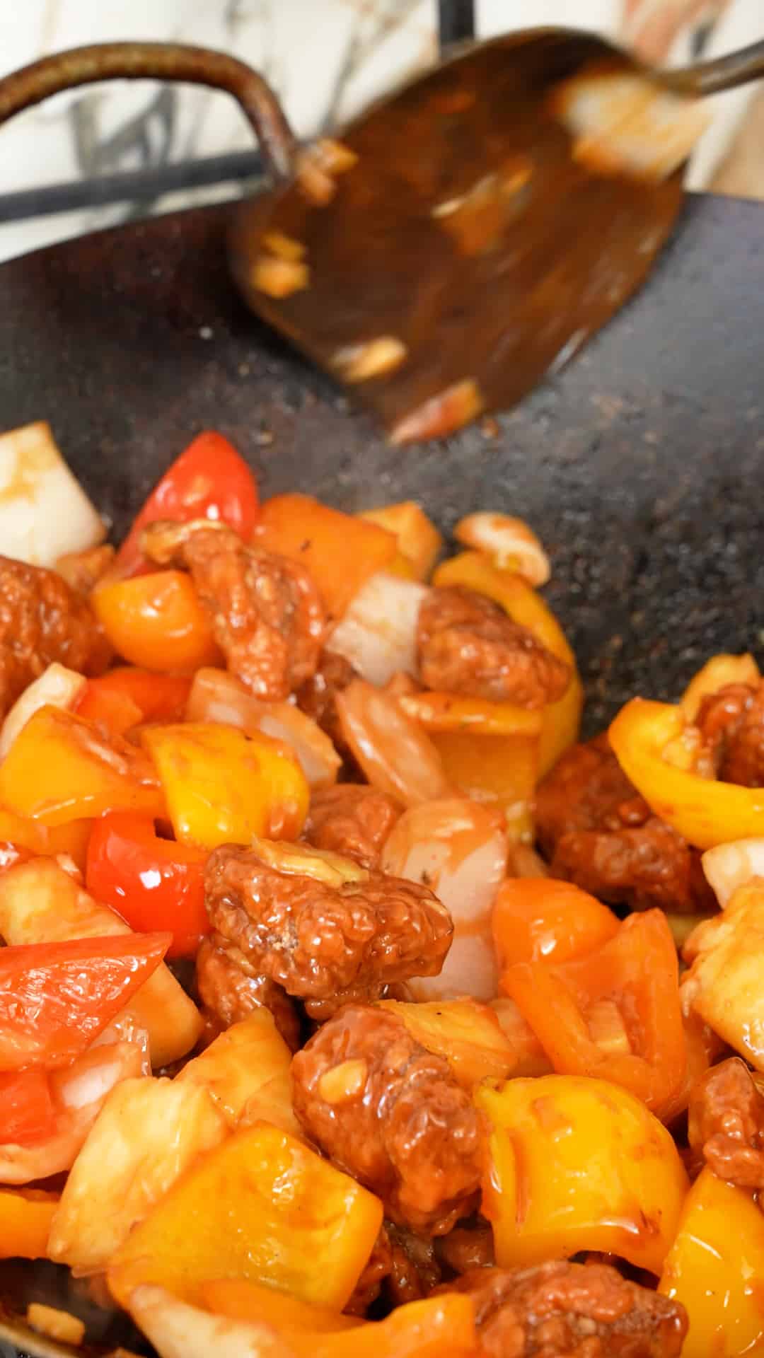 Sweet and Sour pork cooked in a wok.