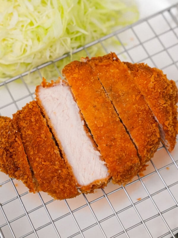 Tonkatsu on a plate with shredded cabbage.