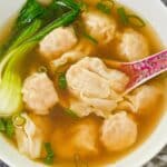 A bowl of authentic easy wonton soup with bok choy and wontons.
