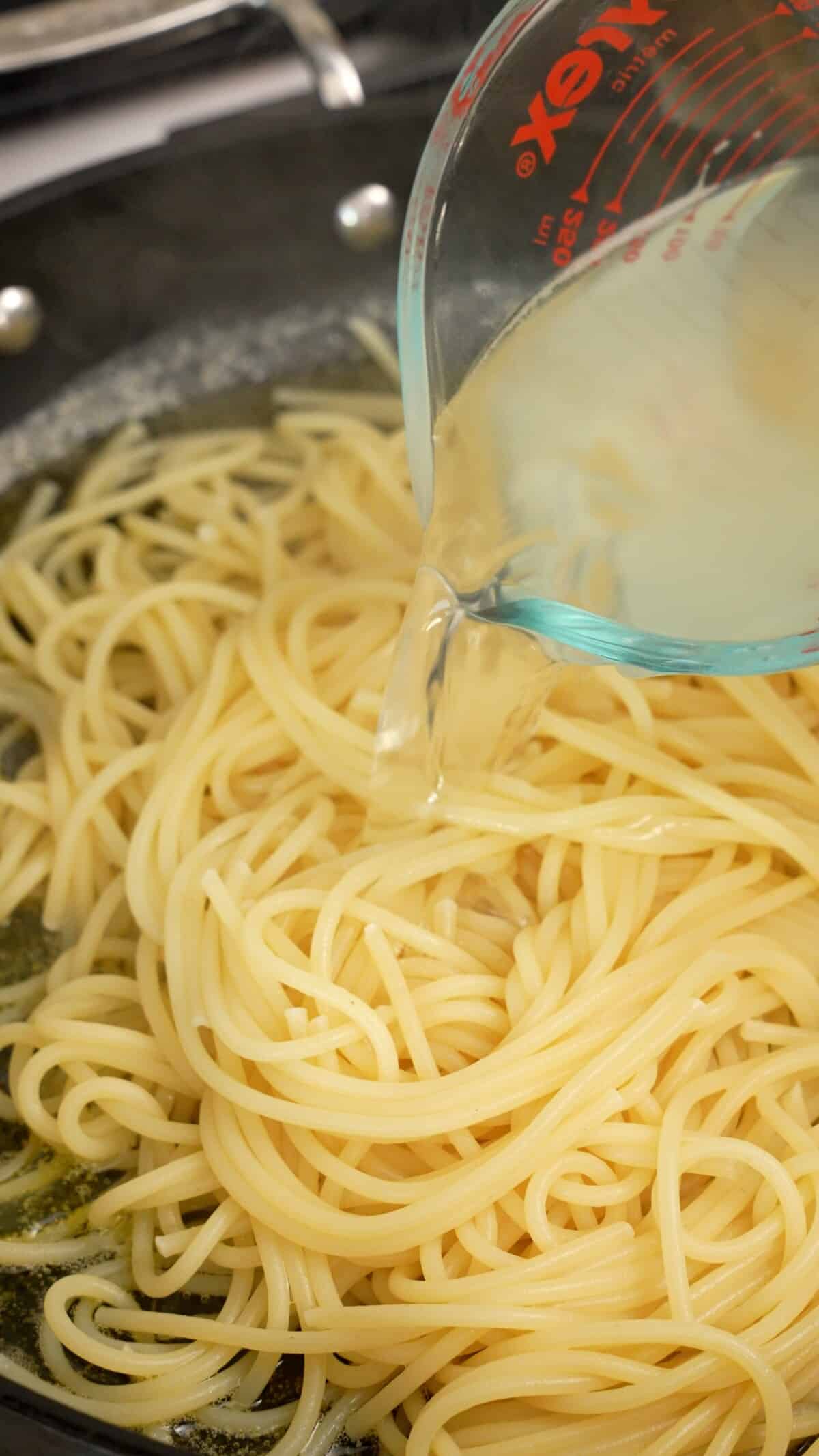 Pasta water added to pasta and butter.