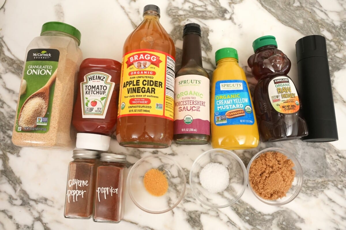 Raw ingredients for homemade BBQ sauce on a table.