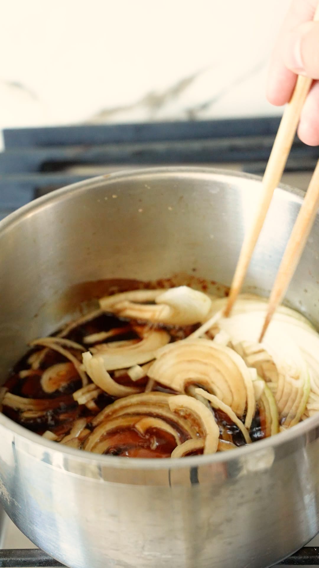 Onions cooking in the beef gyudon sauce.