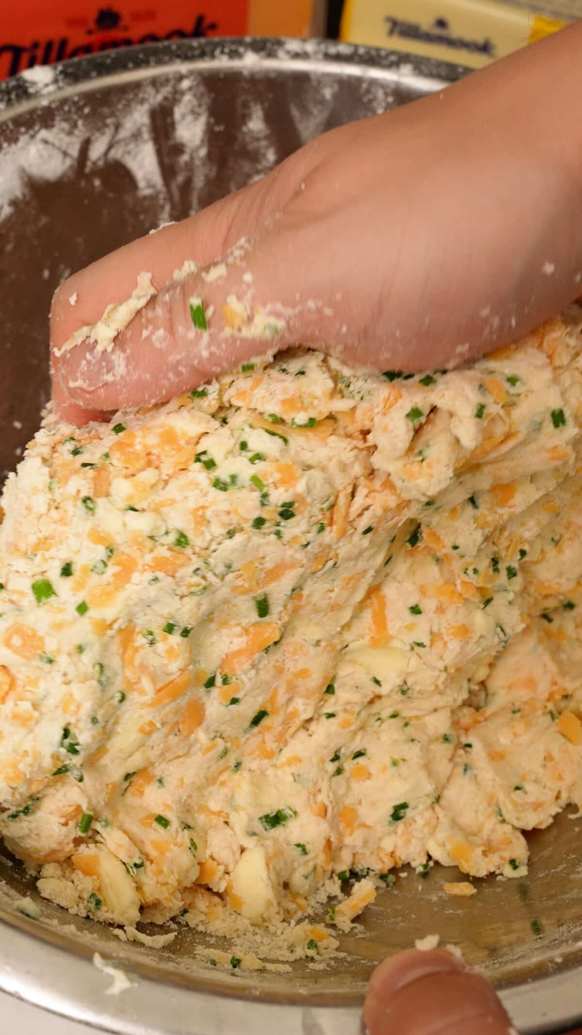 Forming the biscuit dough in a bowl.