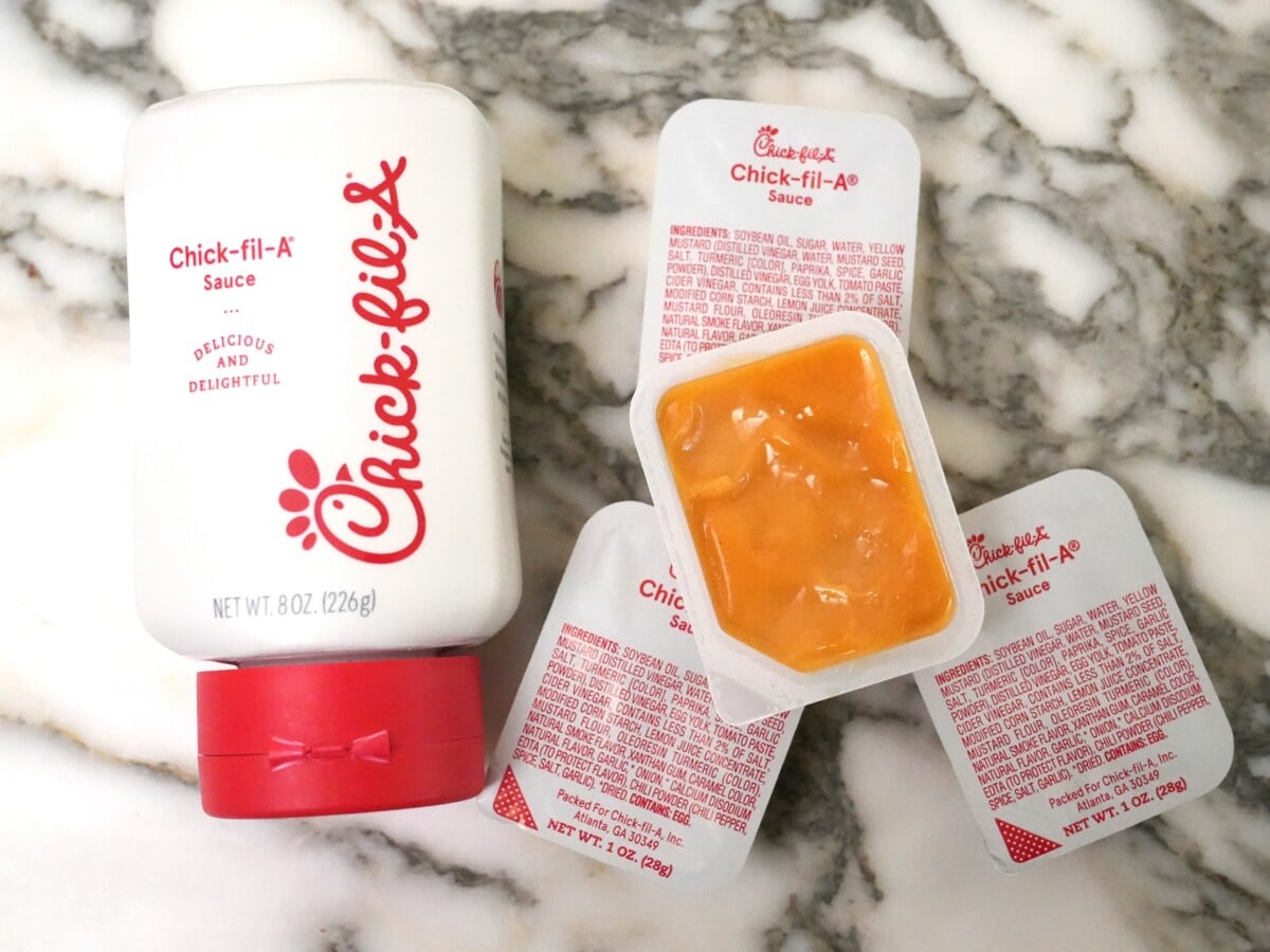 Chick-Fil-A sauce packaged in a bottle and containers.