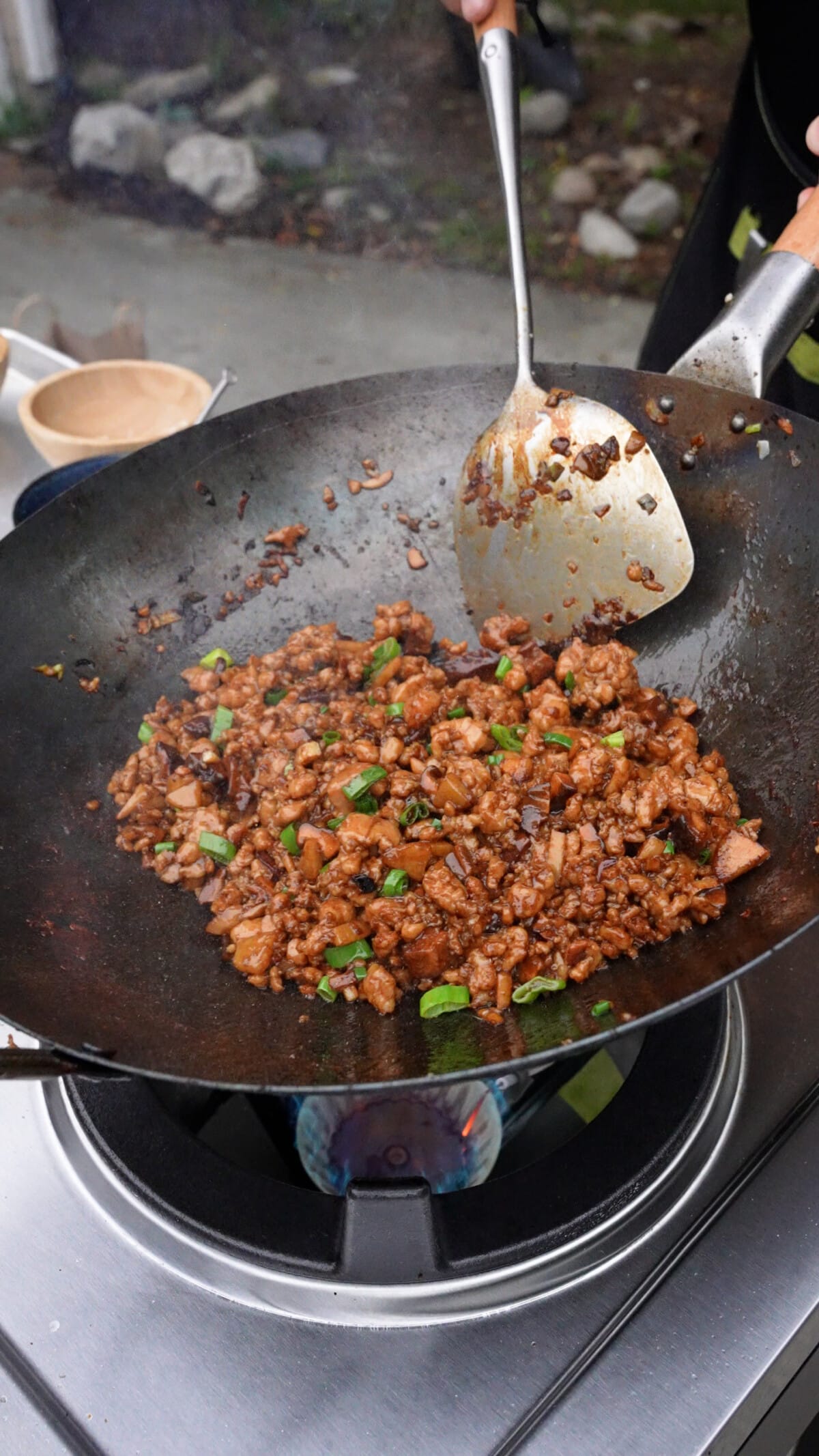 The chicken filling for chicken lettuce wraps cooked in a wok.