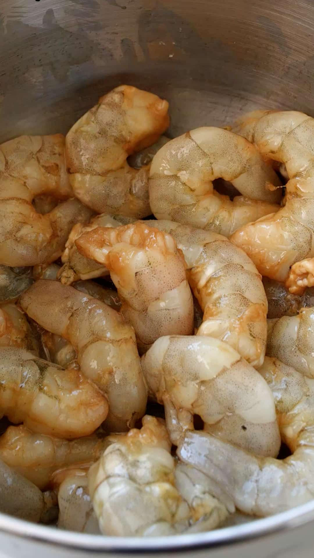 Marinating shrimp in a bowl.