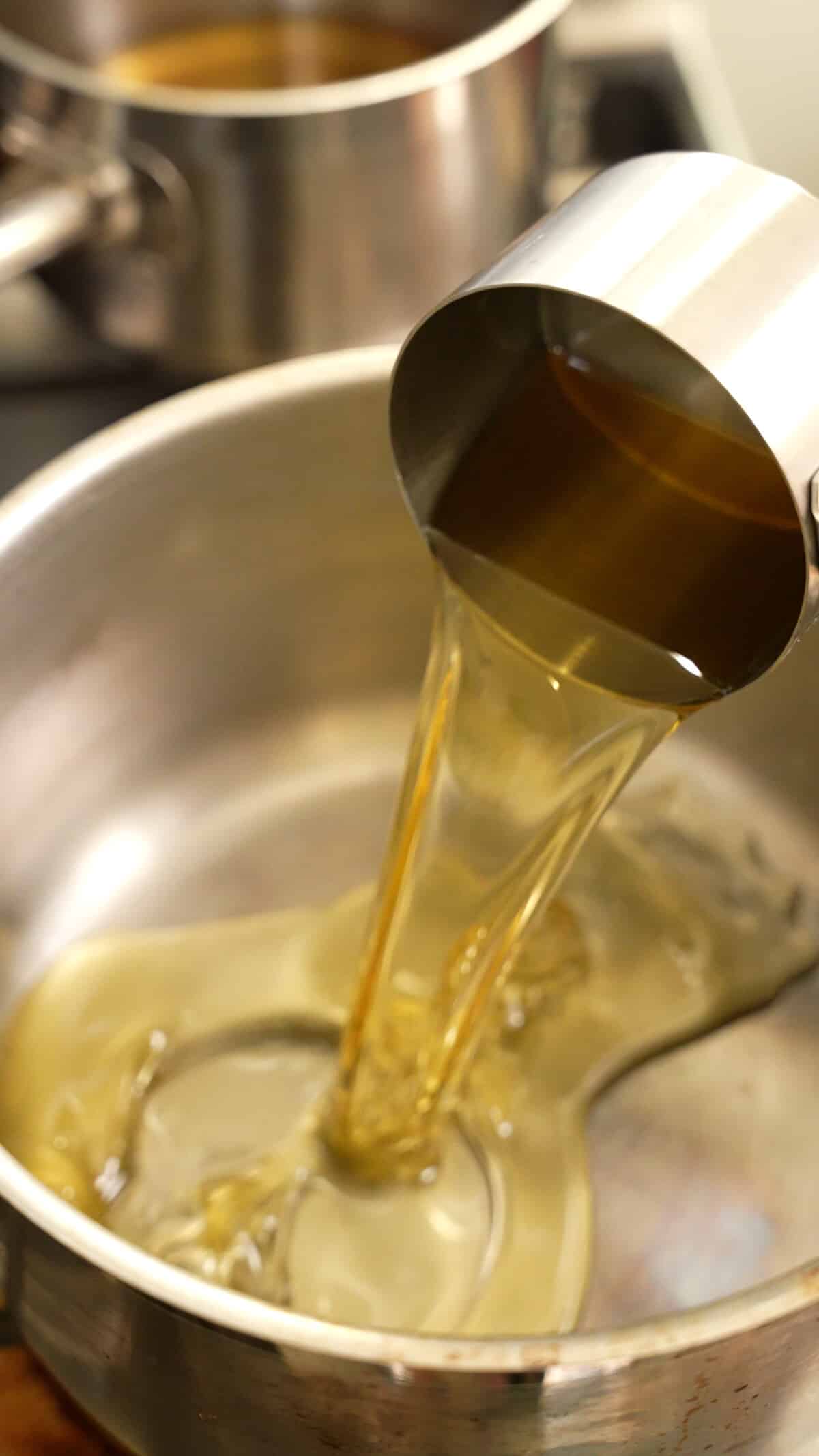 Neutral oil being poured into a pot.