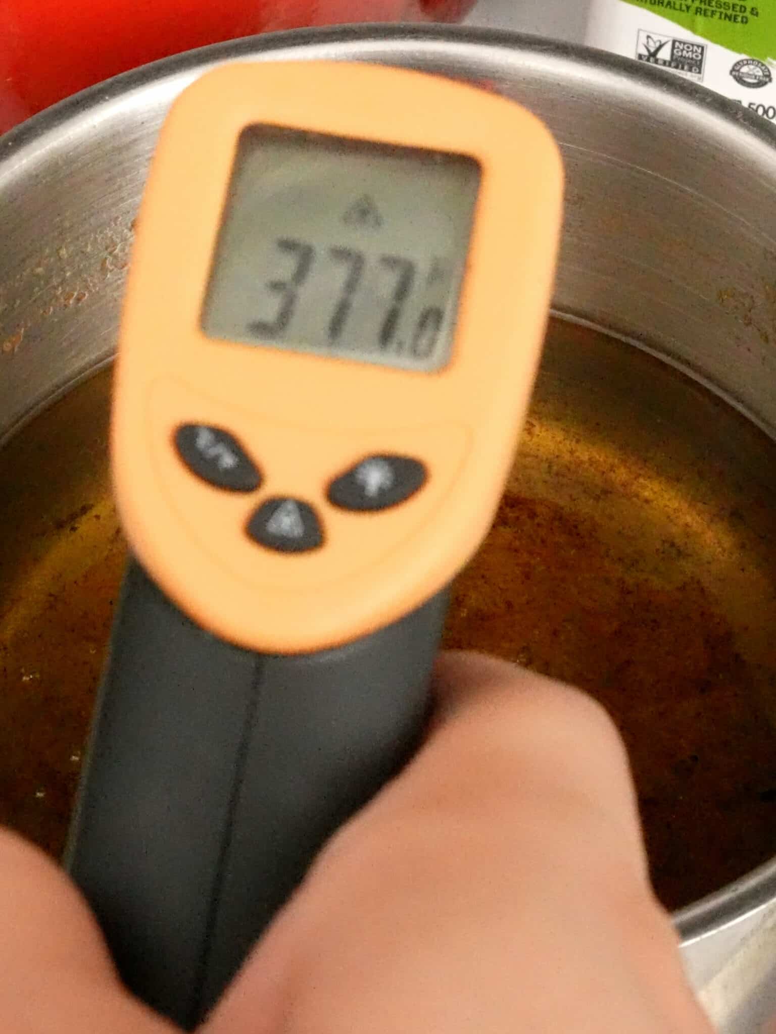 A thermometer that reads 375°F over hot oil.