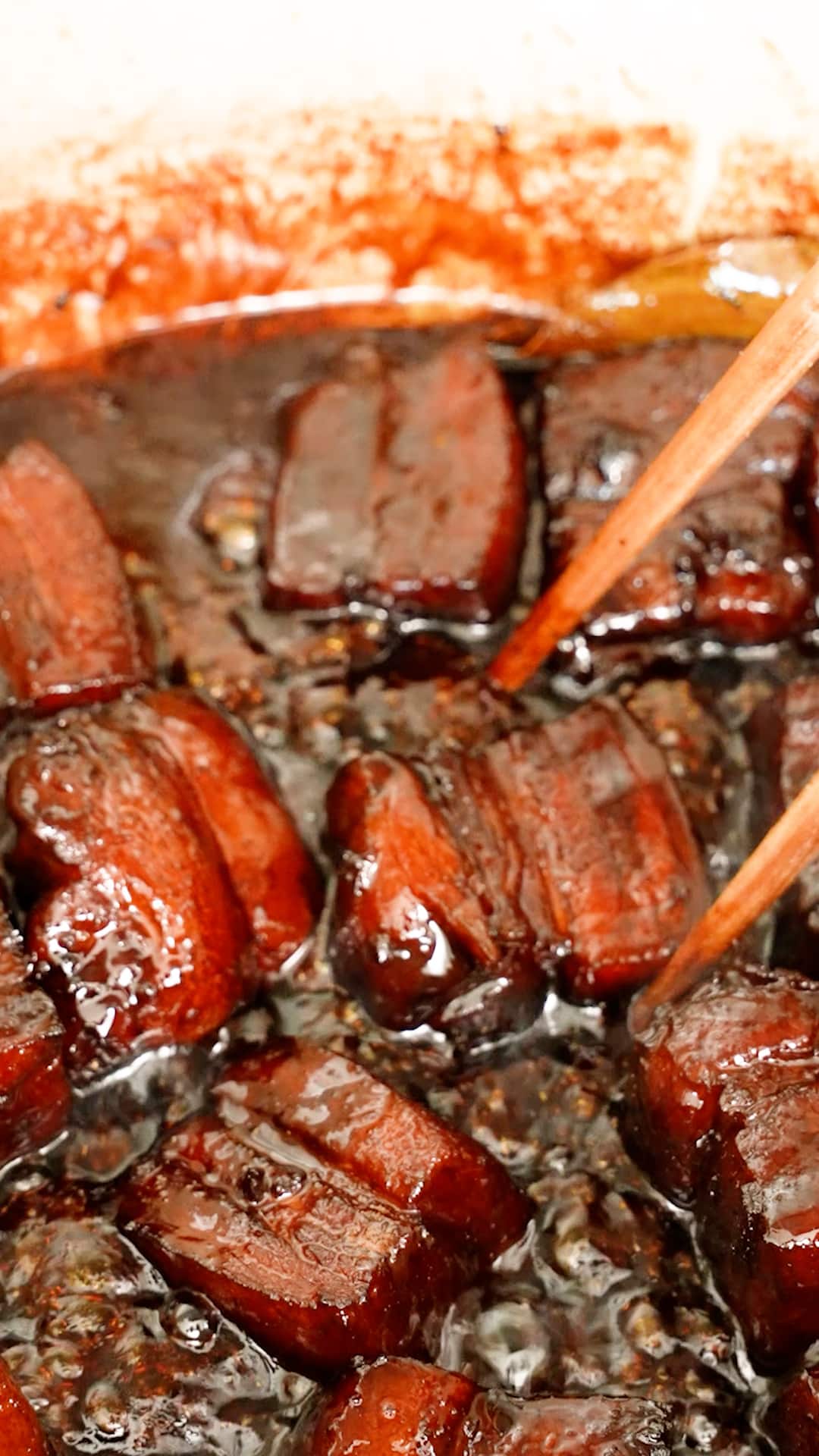 Pork Belly simmered in the hong shao rou sauce that has been thickened in a pot.