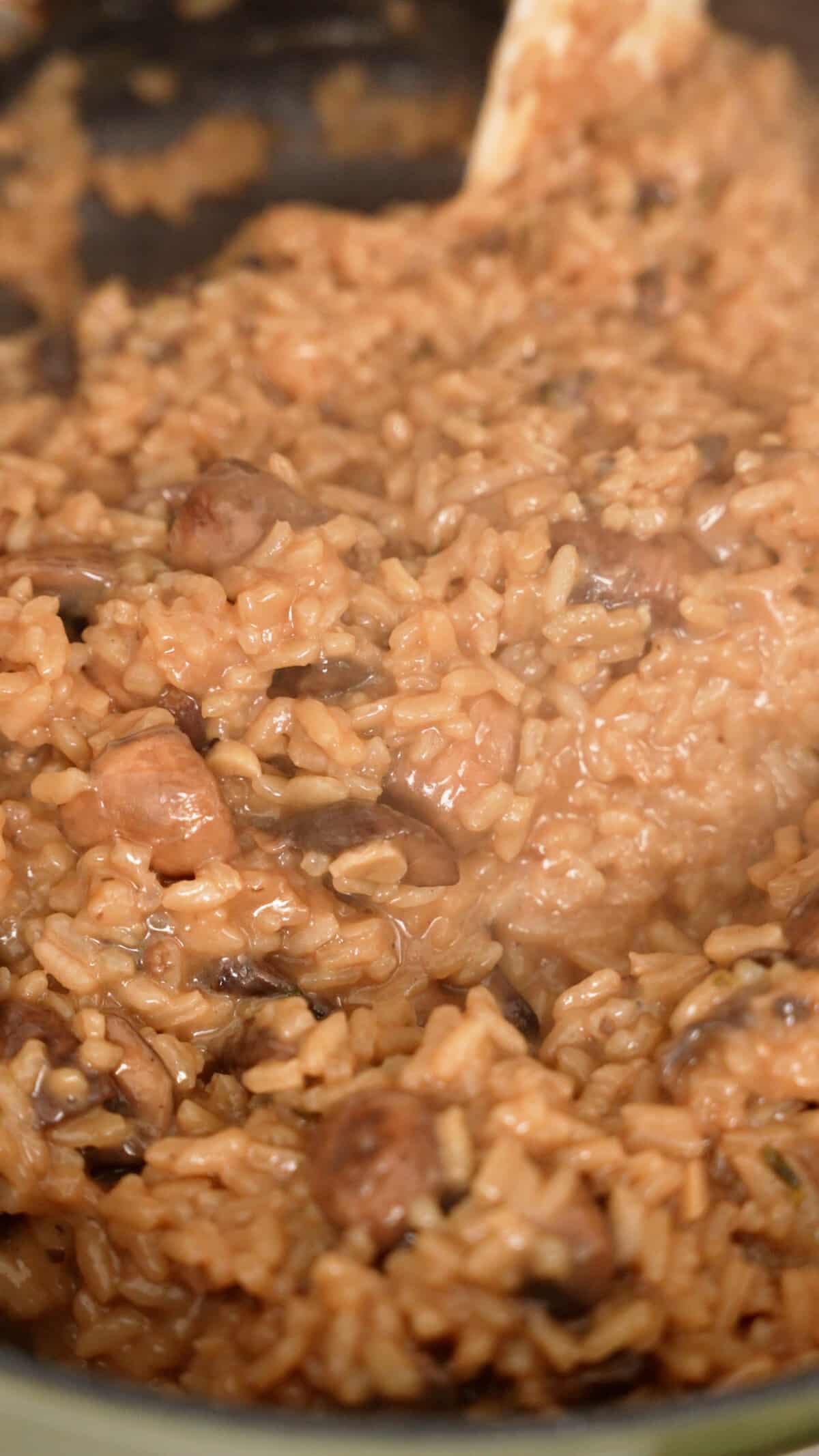 Cooked mushroom risotto in a pan that looks creamy.