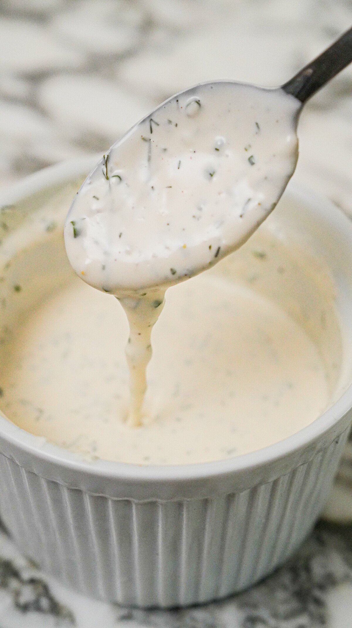 Ranch Dressing in a bowl with a spoon.