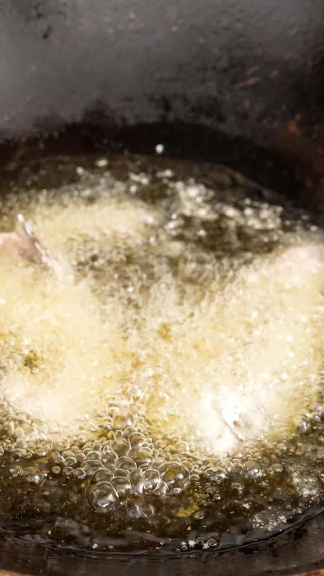 Shrimp frying in a wok.