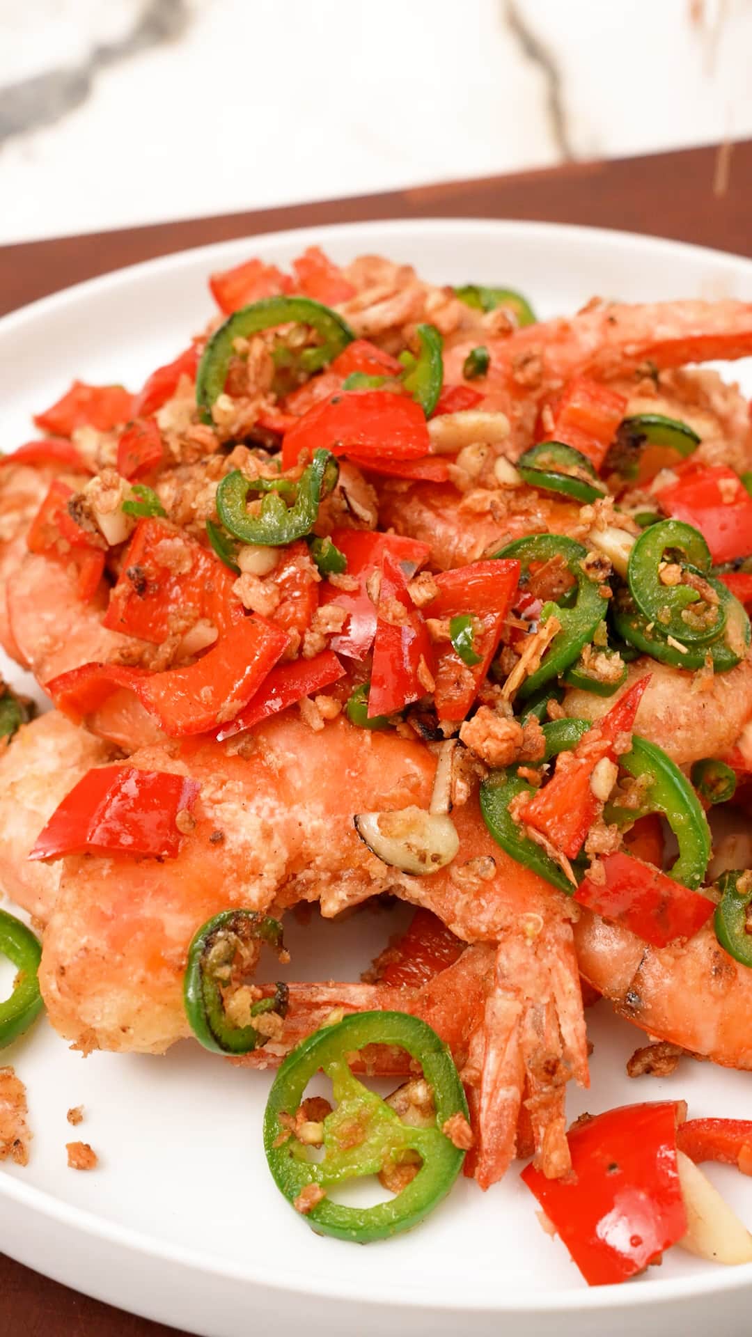 Salt and pepper shrimp on a plate.