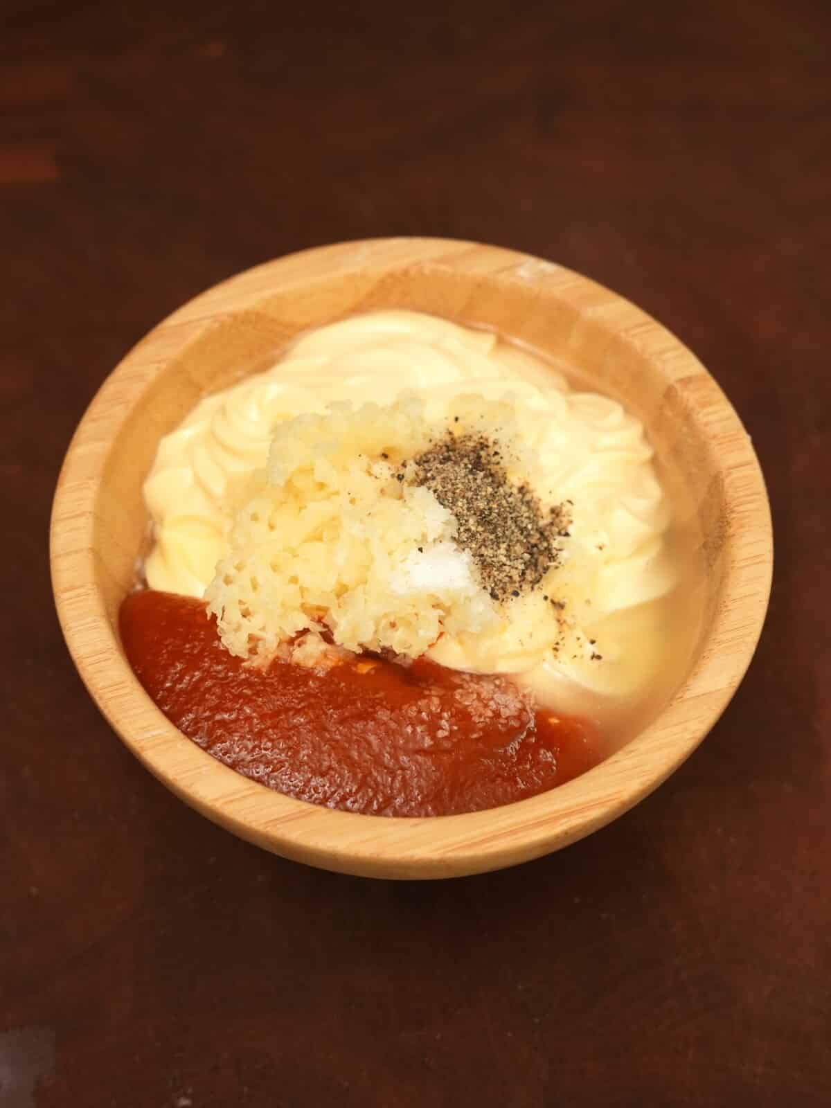 Raw ingredients for homemade spicy mayo.