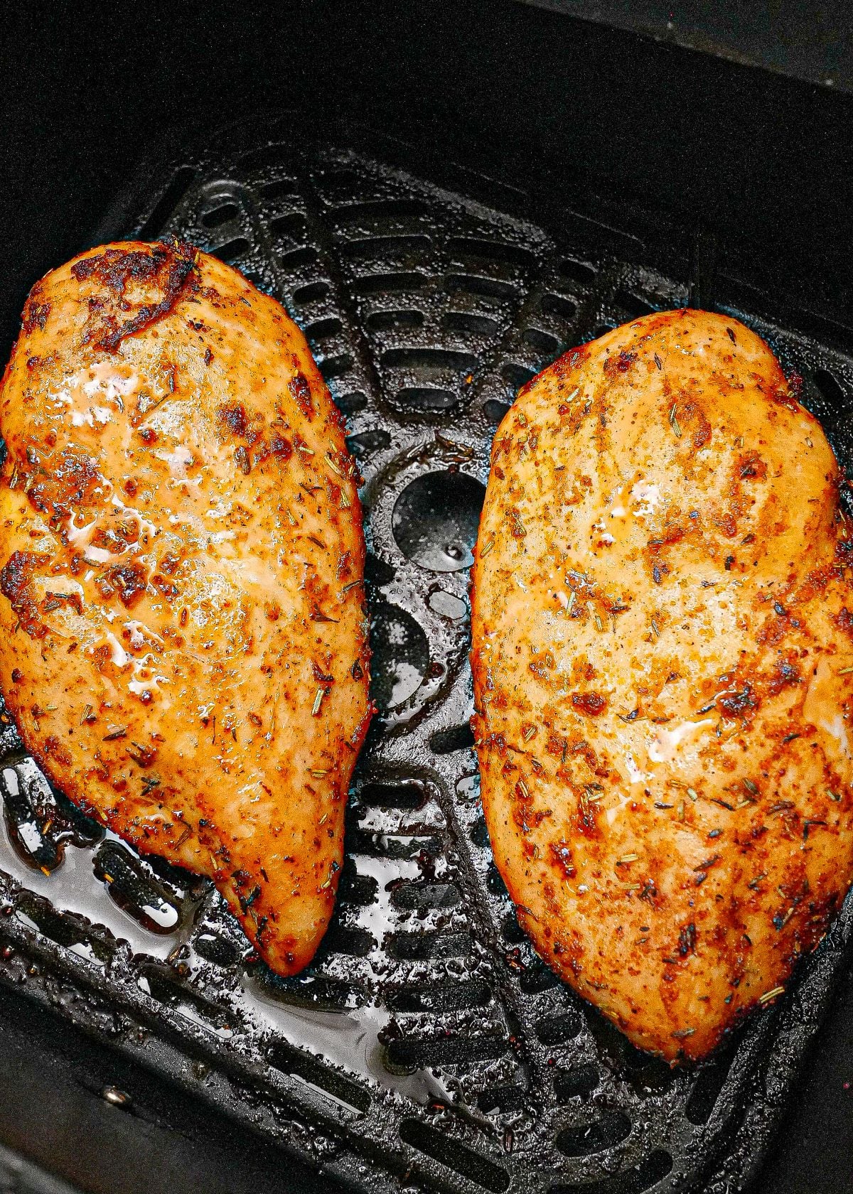 Juicy air fryer chicken breasts cooked in the air fryer.