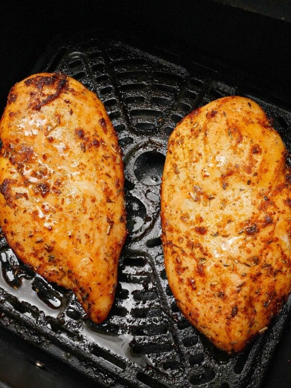 Two chicken breasts cooked in the air fryer.