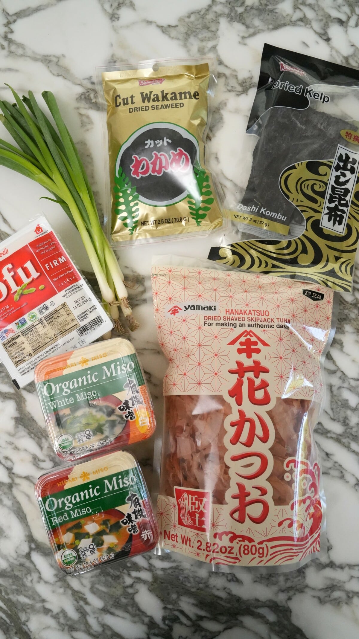 Raw ingredients for miso soup on a table.