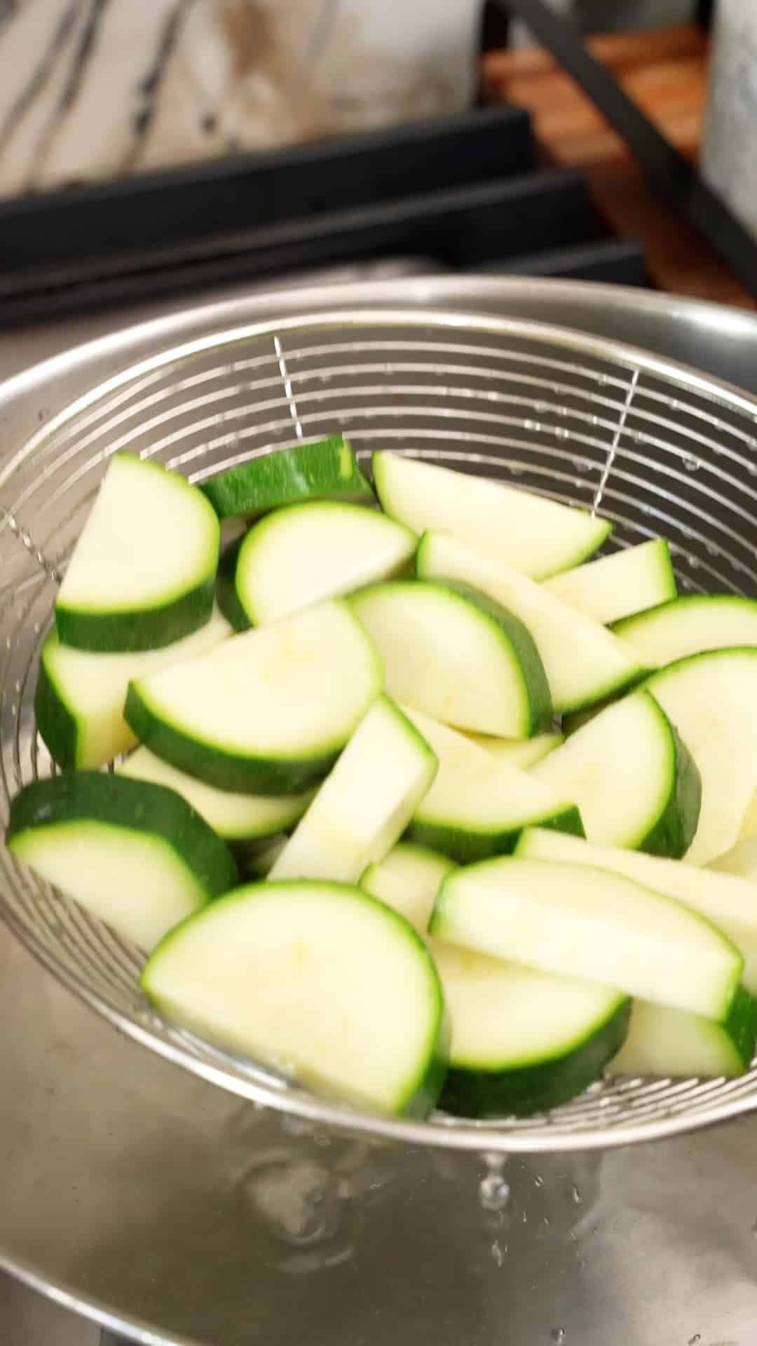 Zucchini blanched in a pot of boiling water.